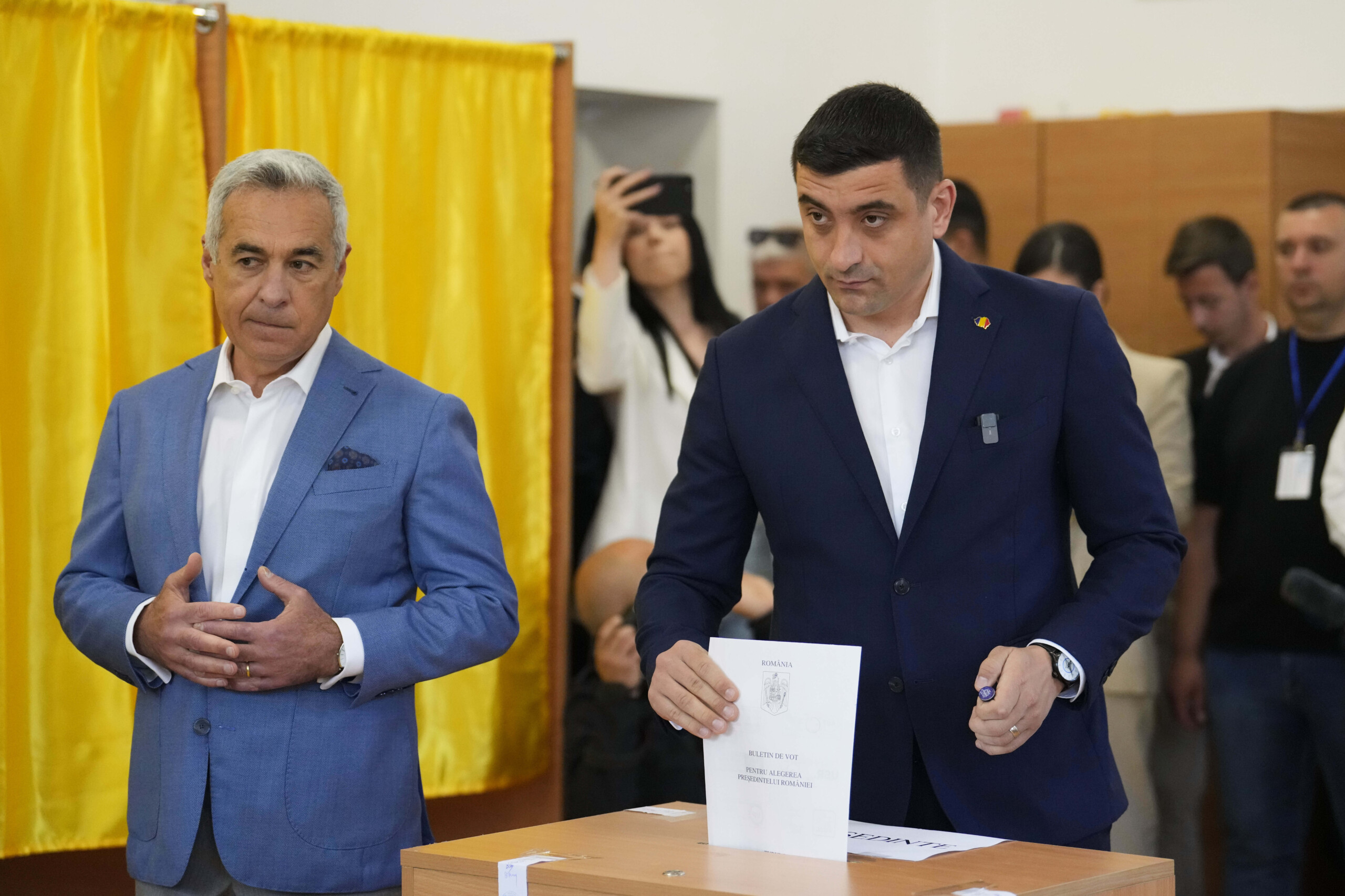 romania simion wins first round heads to runoff against dan scaled