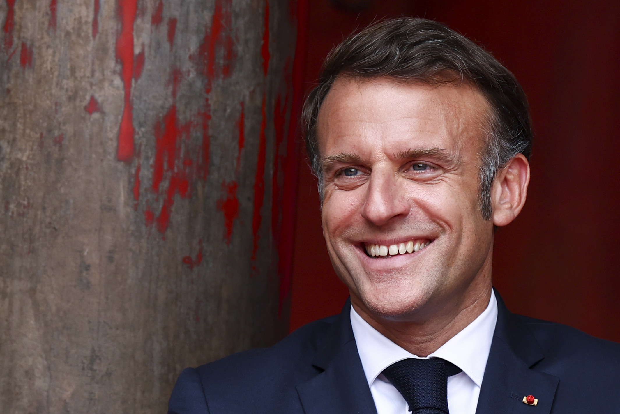 france image of macron with black eye to advertise self defence course