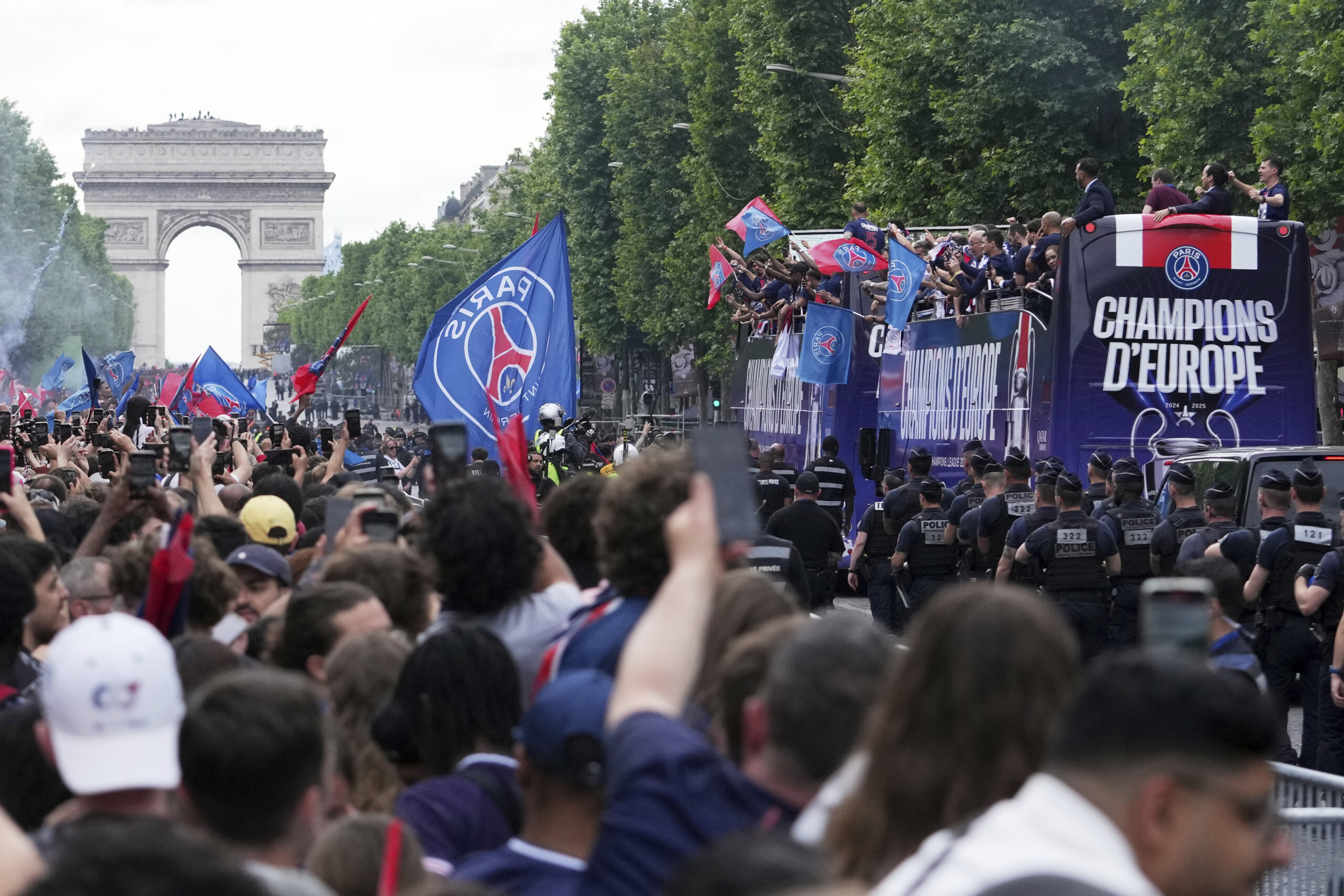 champions league psg parades down the champs elysees with the trophy scaled