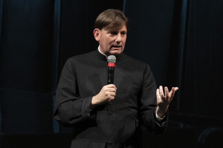 rome insults and stones thrown at father coluccia in quarticciolo