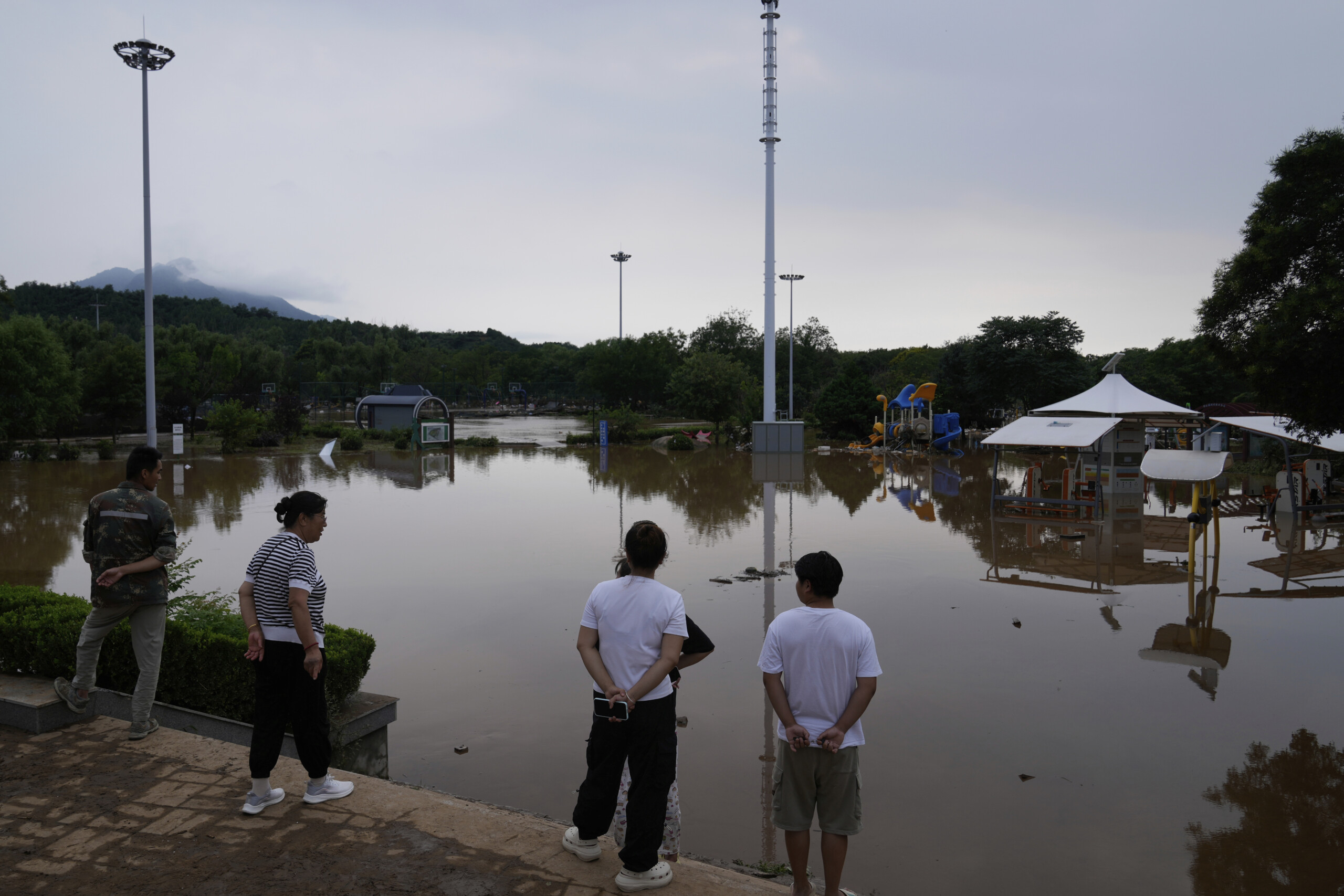 china heavy rains and floods in beijing 38 dead and 80000 evacuated scaled