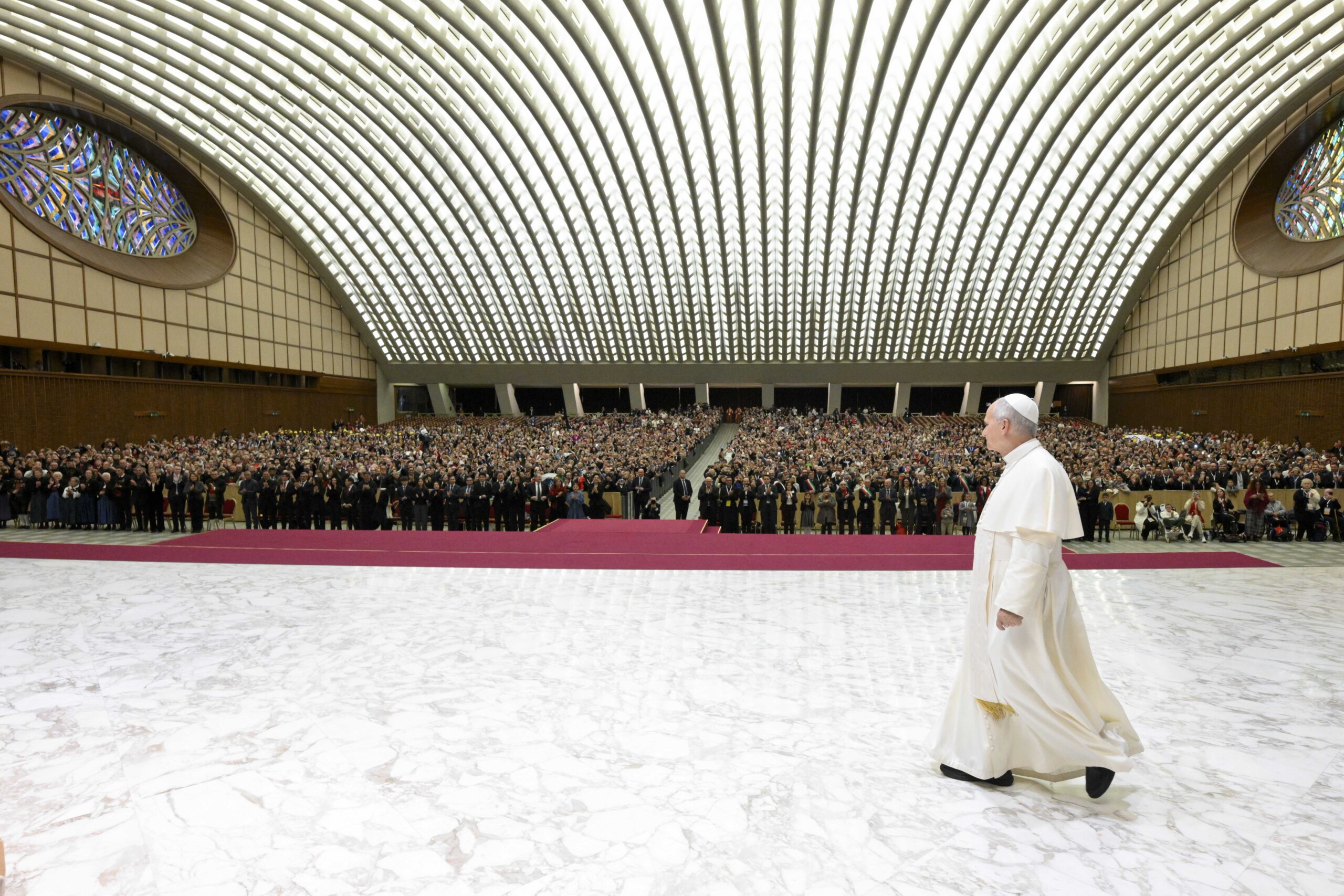 pope leo xiv makes a surprise appearance in the paul vi hall to greet disabled and sick faithful scaled