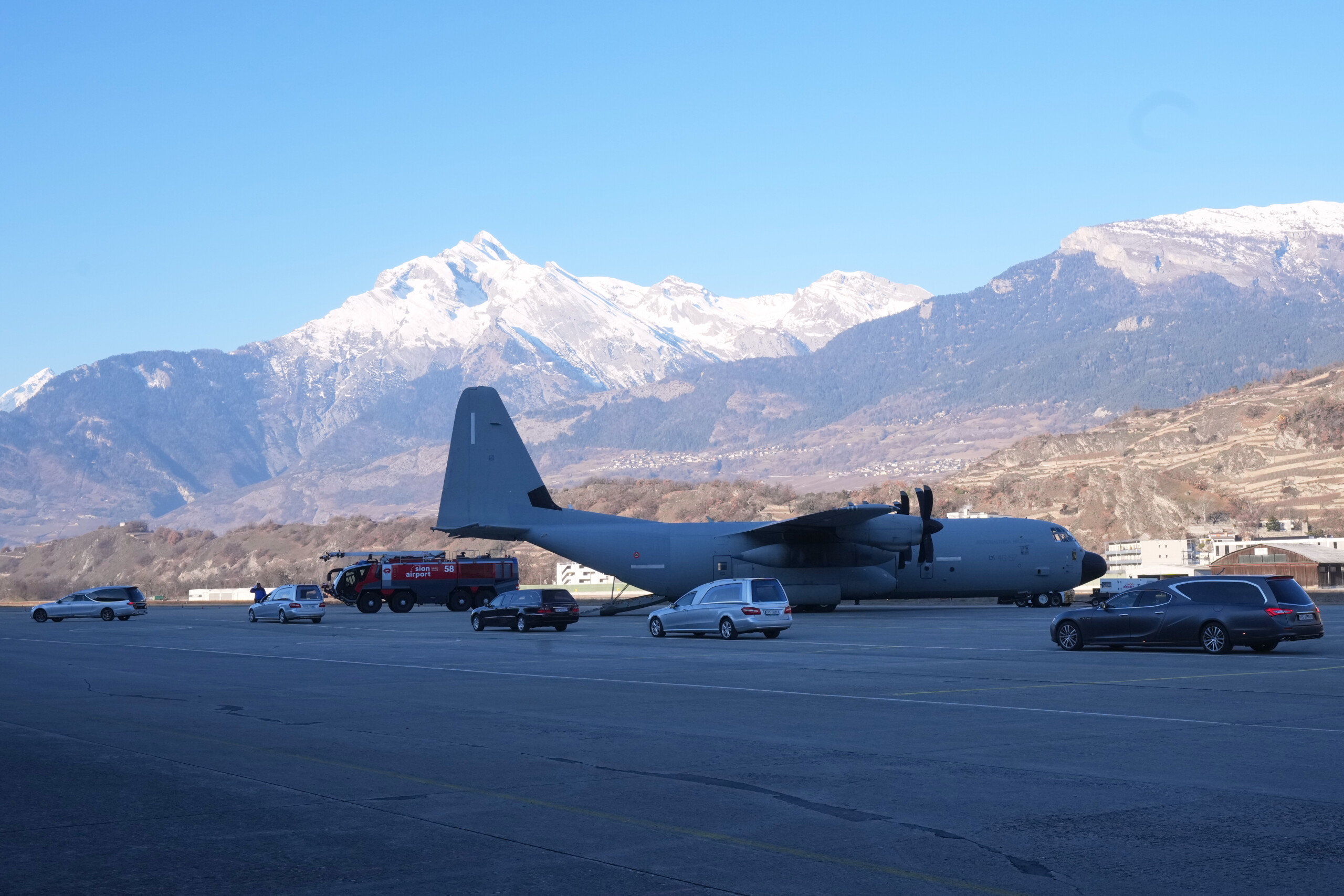 crans montana flight carrying the bodies of 5 victims lands at milan linate scaled