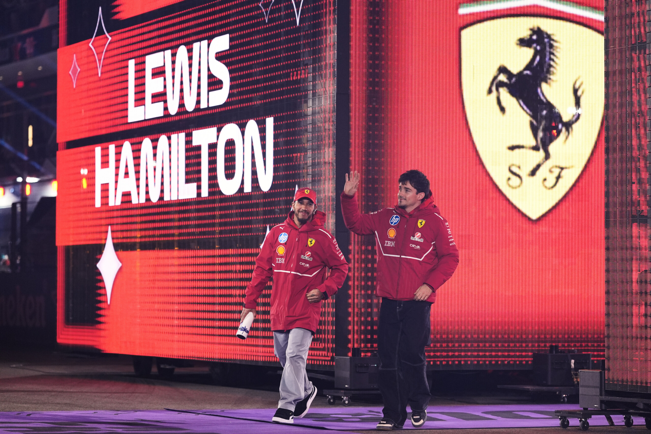 f1 ferrari unveils new suits for hamilton and leclerc on social media scaled